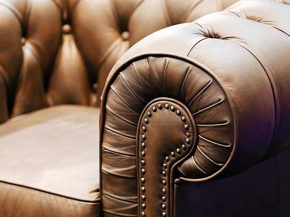 Brown old-fashioned leather sofa