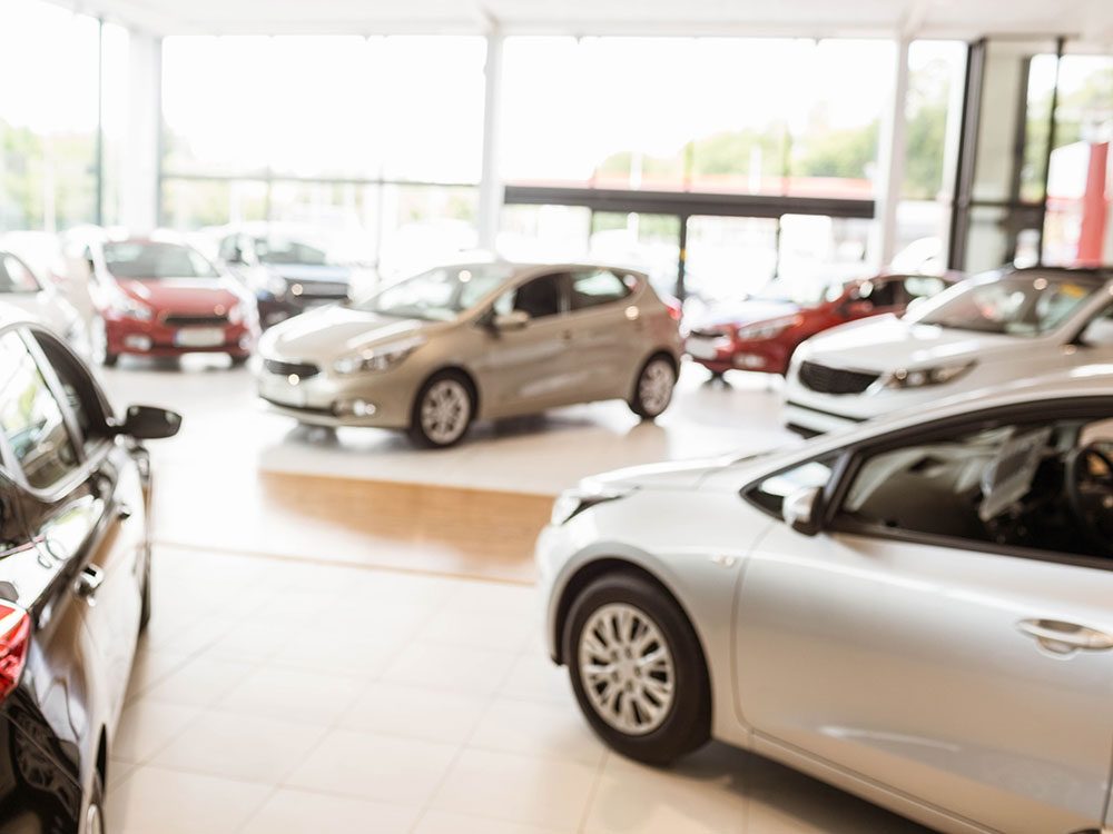 how does a car dealership make money on a lease