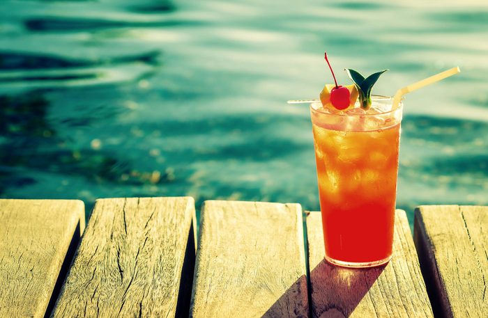 Fruit cocktail on dock of lake