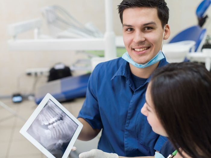 Orthodontist reviewing an x-ray of teeth