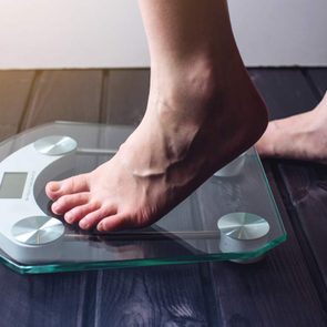 Feet on digital weight scale