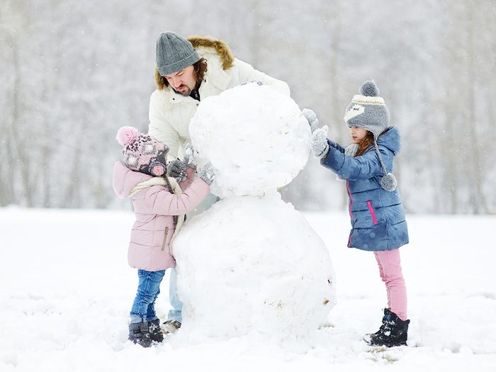 Family building snowman