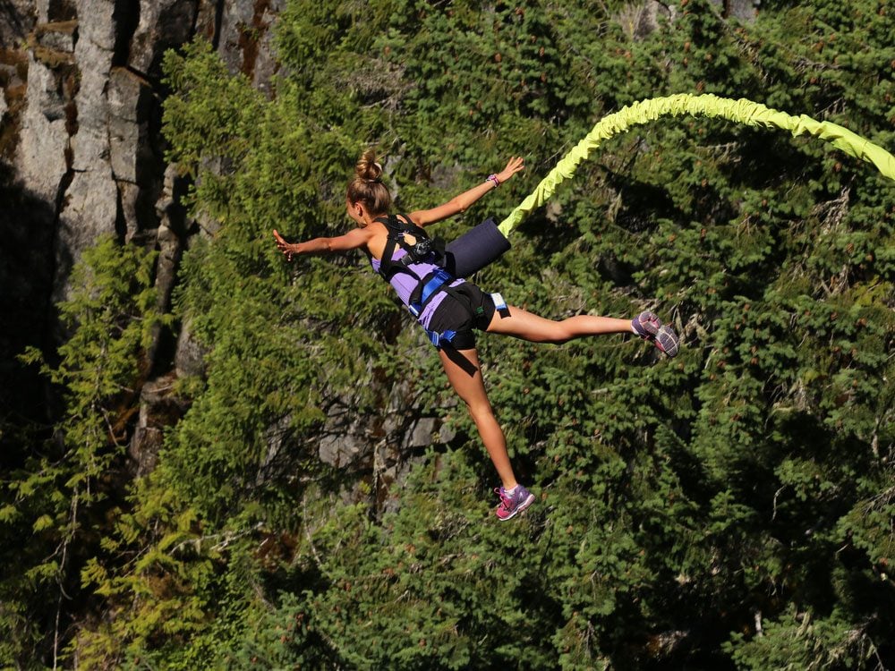 Woman bungee jumping