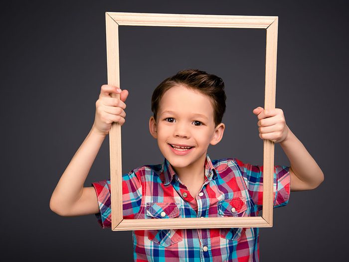 Kid holding frame