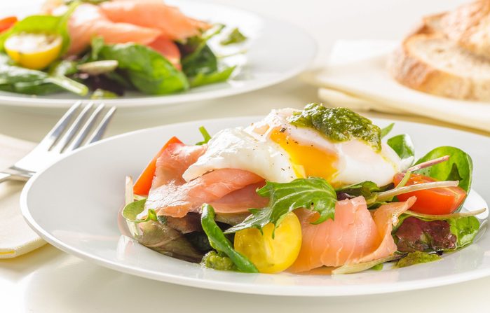 Breakfast salad with smoked salmon and poached egg
