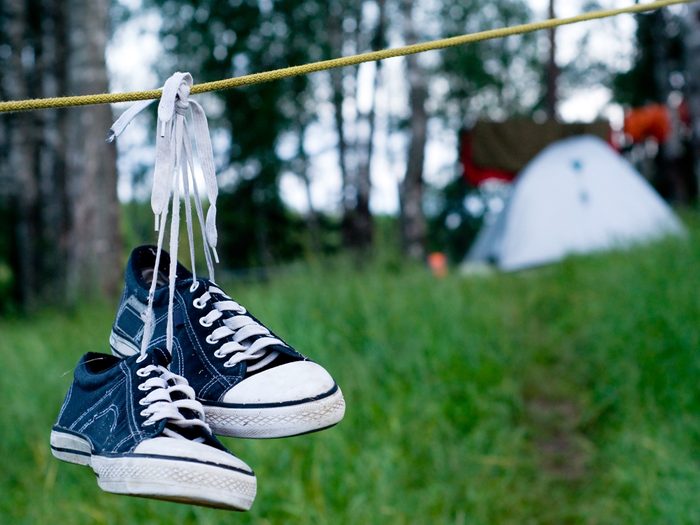 Shoes hanging from a campsite clothesline