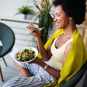 How to eat less - woman eating vegetables