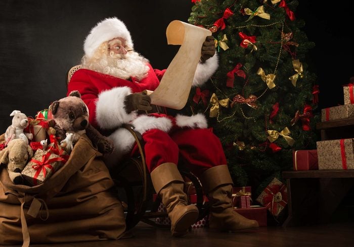 Santa Claus looking at list