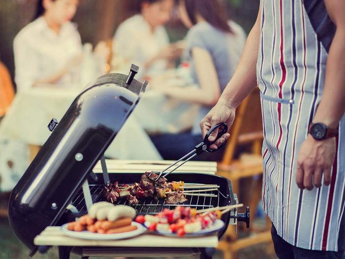 Man grilling food on barbecue