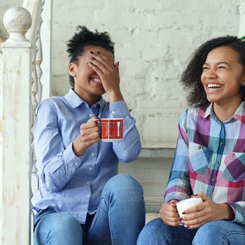 Stress management tips - Two friends laughing