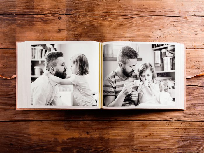 Photo album with pictures of father and daughter