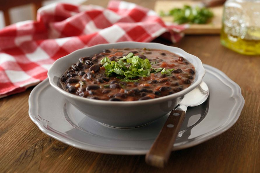 Black bean soup garnished with spring onions