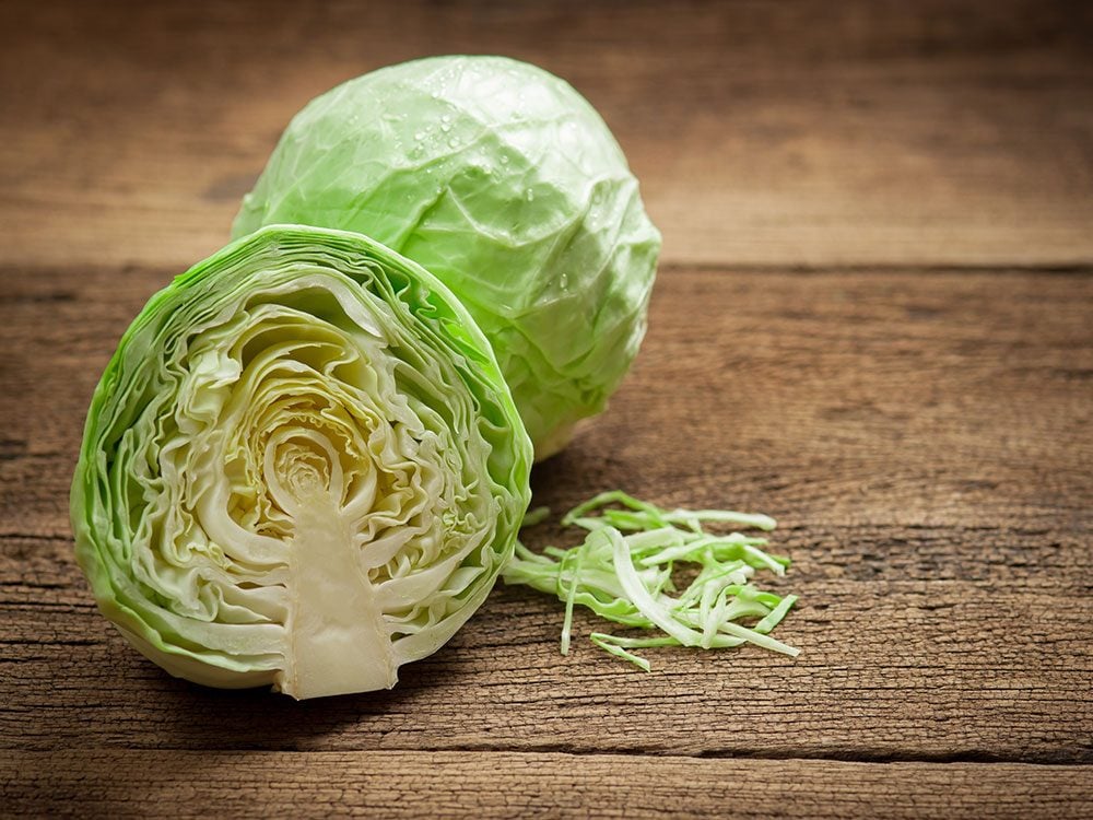 Whole and cut cabbage
