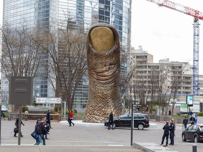 Weirdest landmarks around the world - thumb statue in Paris