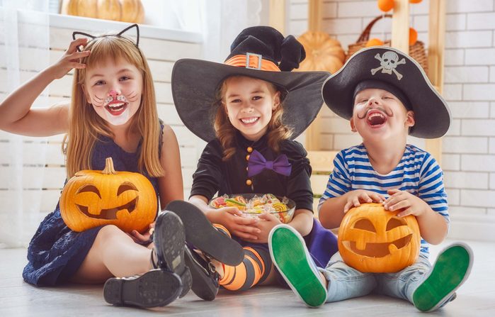 Kids eating Halloween candy and other treats