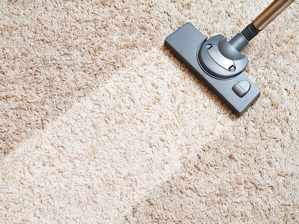 Carpet being vacuumed