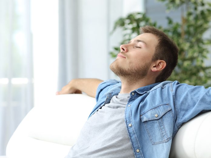 how to get rid of toxic friends - man relaxing on sofa