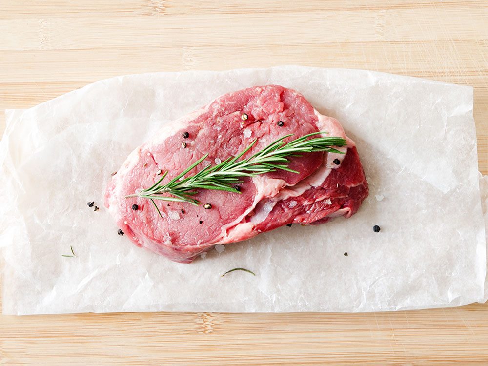 Beef steak on parchment paper
