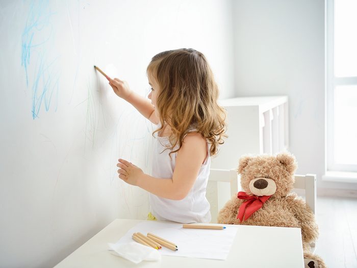 Things to do with toothpaste - little girl drawing on wall with crayons