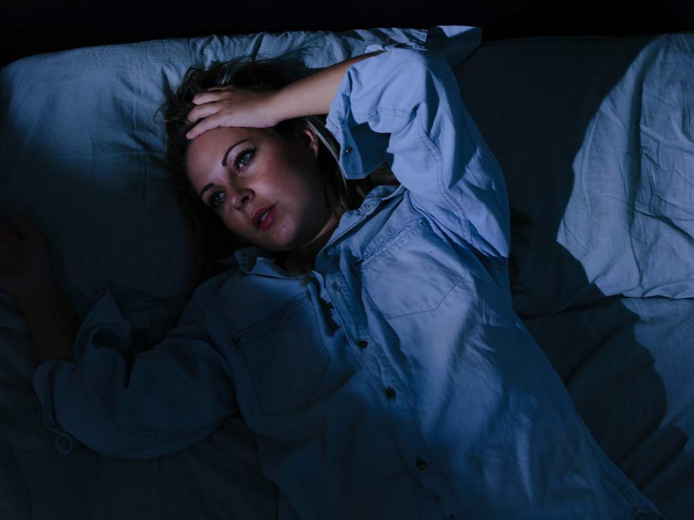 Woman laying awake at night