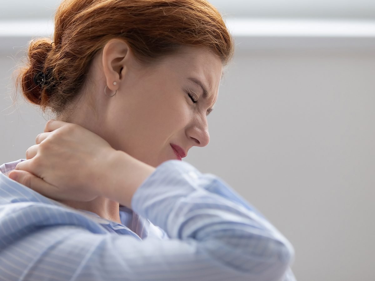 woman suffering stiff neck