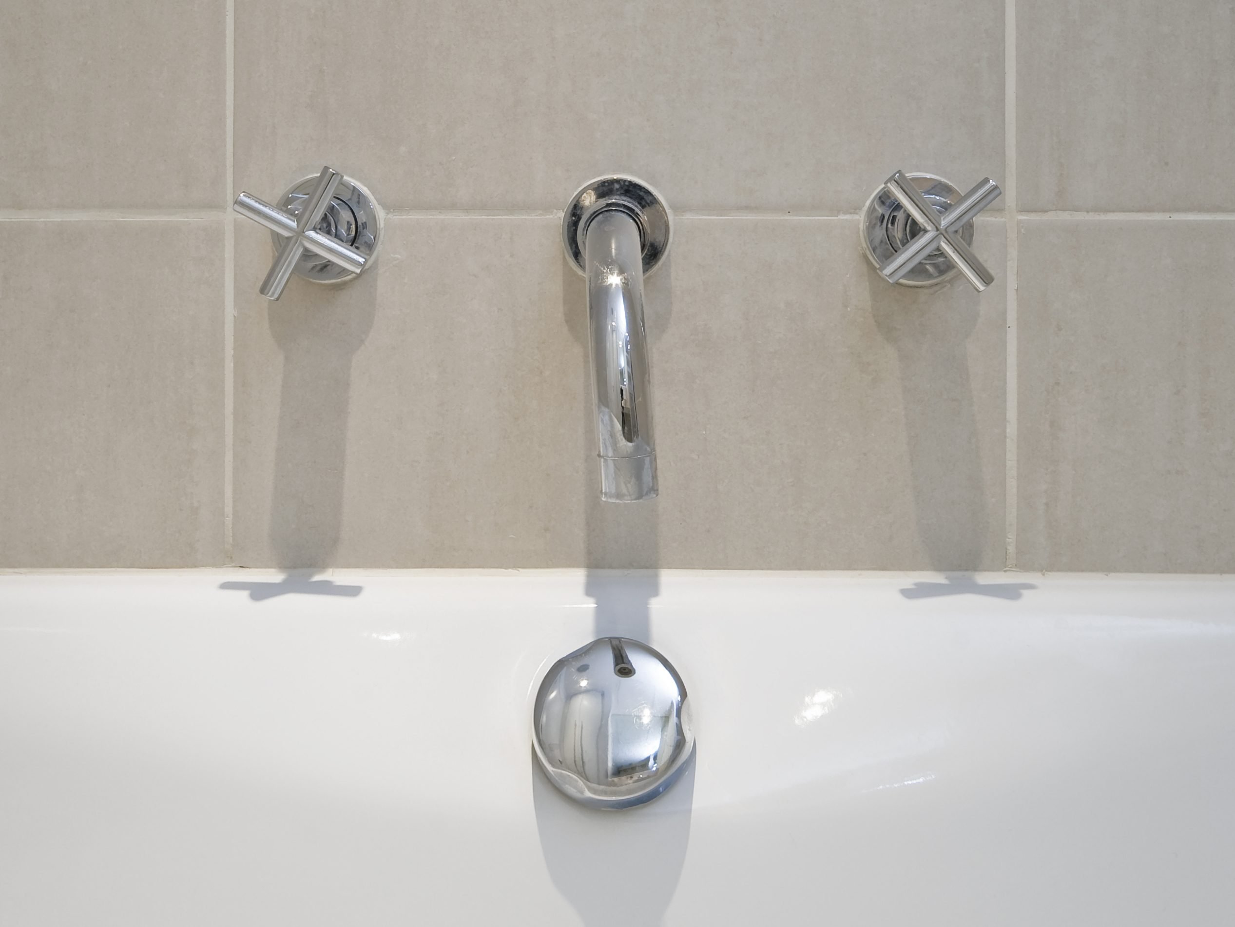 5. Clean the Tub and Faucets with Shampoo