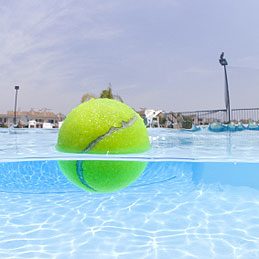 Fun things to do with a tennis ball: Keep a pool oil-free