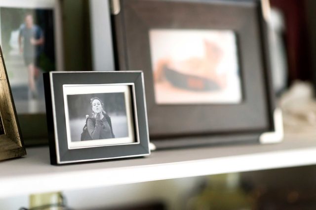 Picture frames displayed on shelf