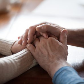 How to be a more compassionate person - two people holding hands