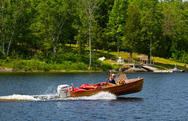 Woman takes her cedar strip boat to the cottage