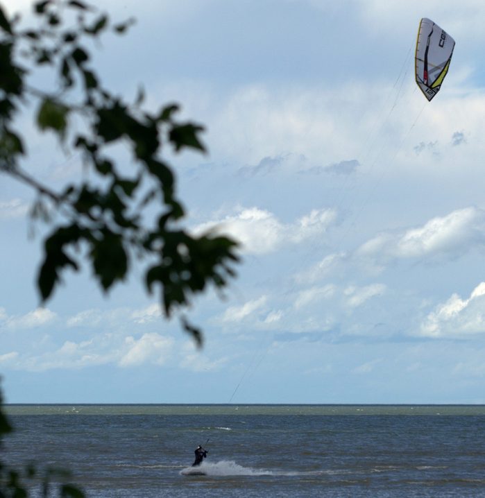 Man kitesurfing at the cottage
