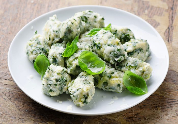 Spinach gnocchi with grated parmesan cheese