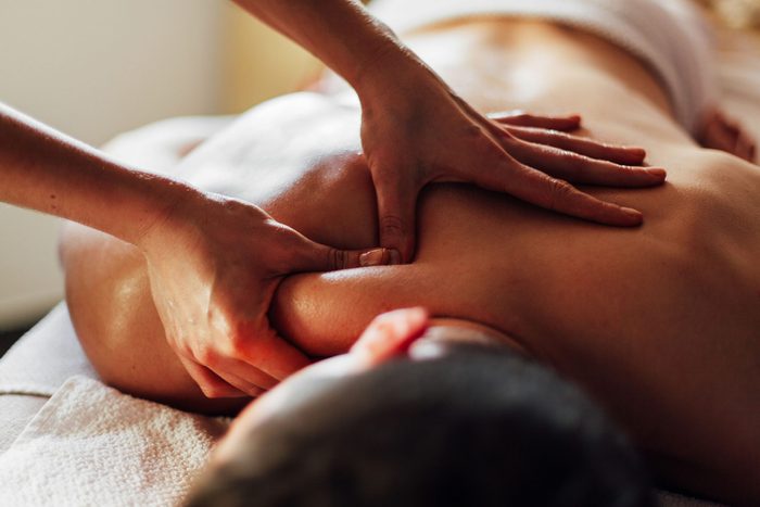 Man being massaged by chiropractor