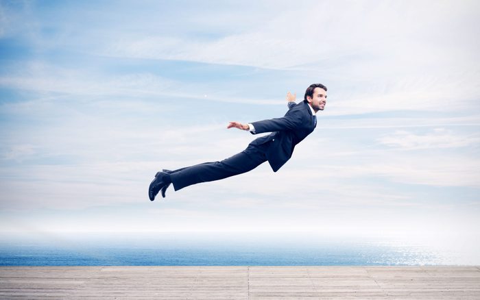 Man in a suit flying