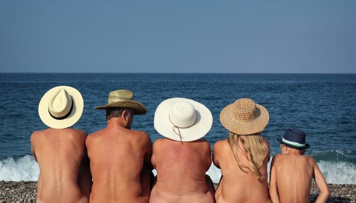 Naked family on the beach