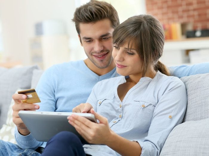 Couple shopping online on a tablet