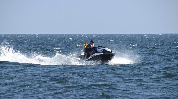 Father and son jet skiing 