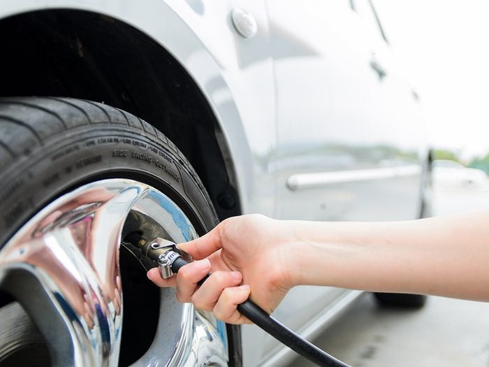 Car repair tips - Checking tire pressure. Pumping air into auto wheel. Vehicle safe concept.