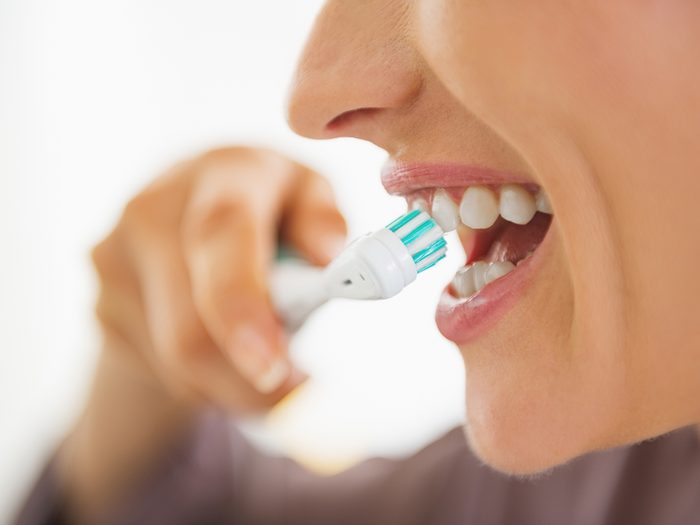 How to improve gut health - brushing teeth