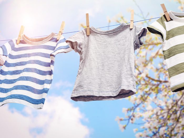 Energy saving guide - Rope with clean clothes outdoors on laundry day