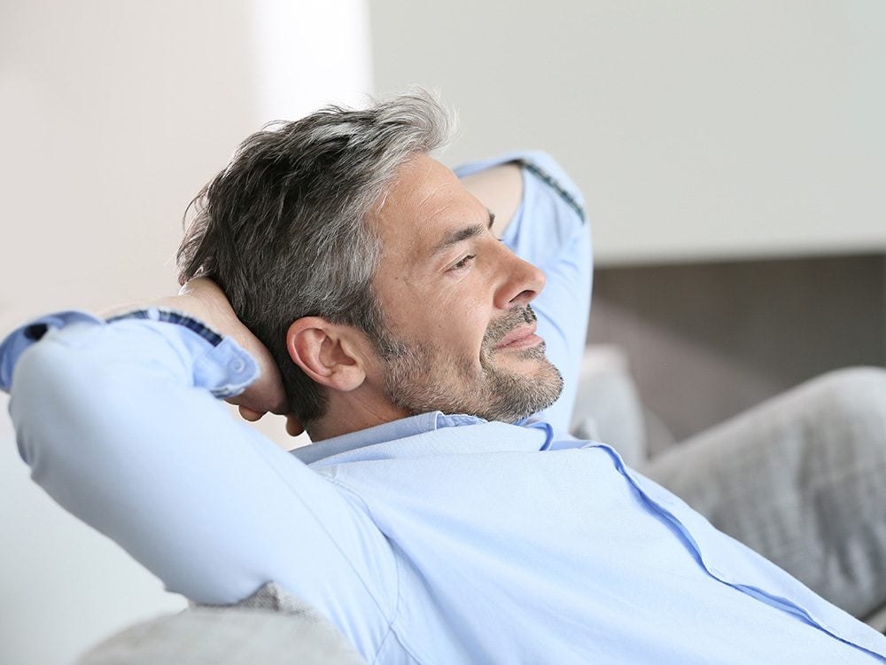 Man relaxing on couch