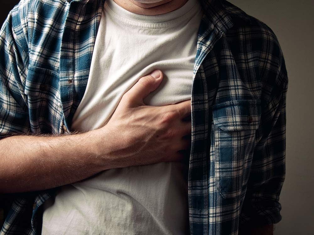 Man experiencing heartburn