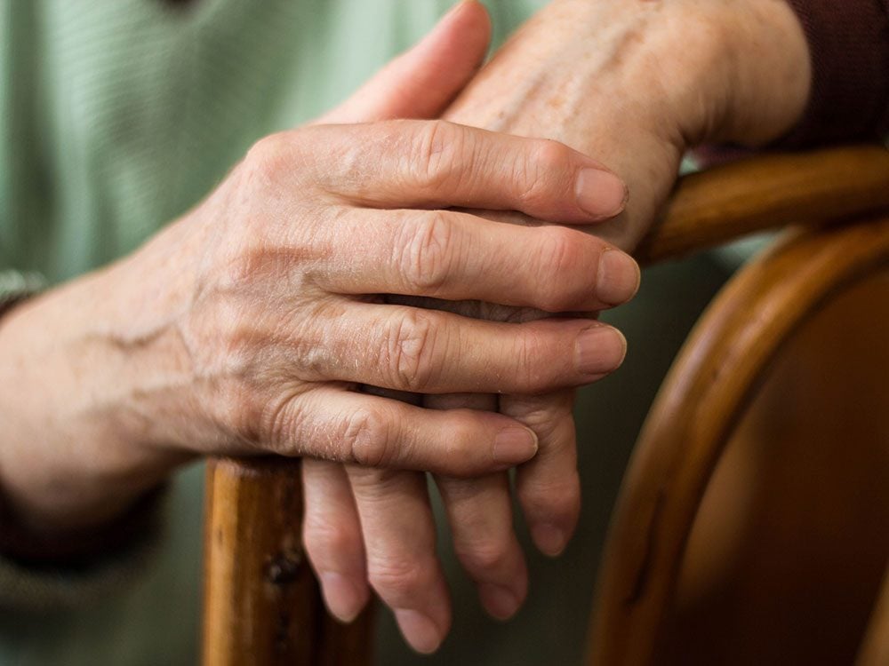 Close-up of elderly person's hands