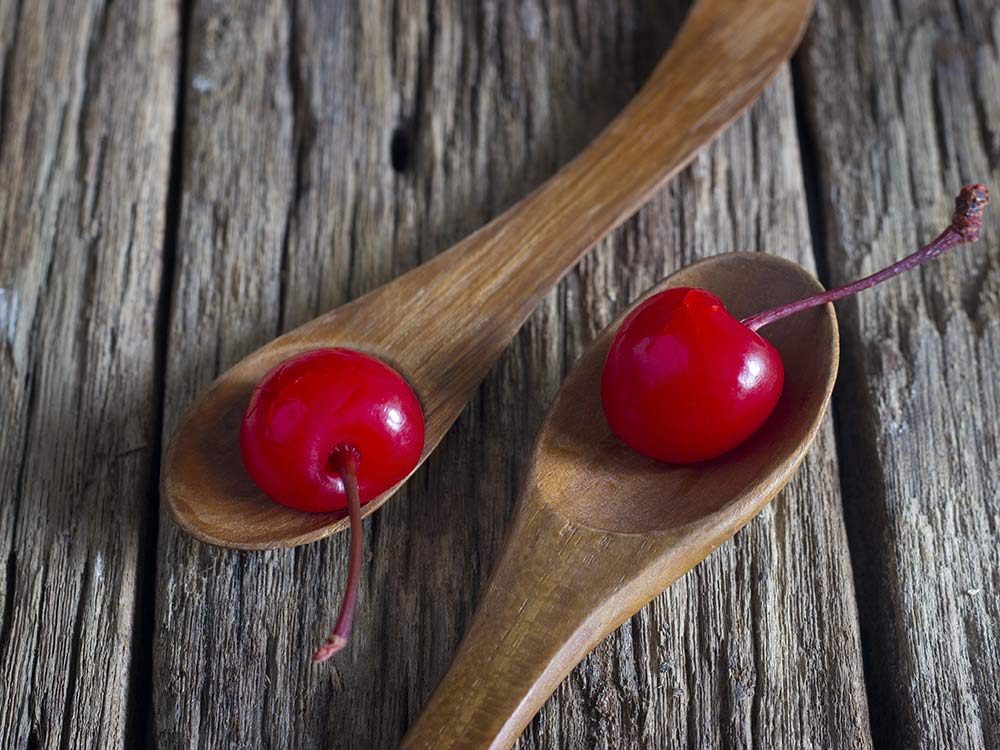 Maraschino cherry on wooden table
