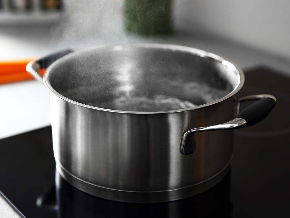 Boiling water in pan on stove