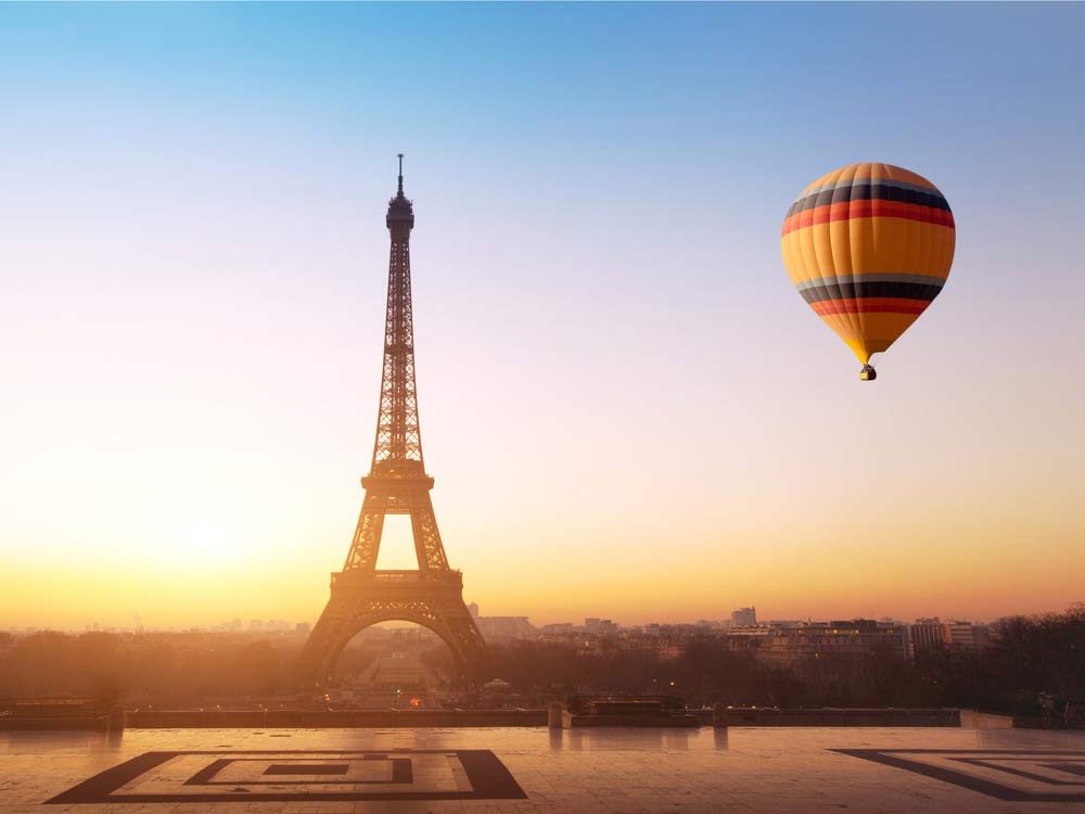 Hot air balloon flying near Eiffel Tower in Paris, France