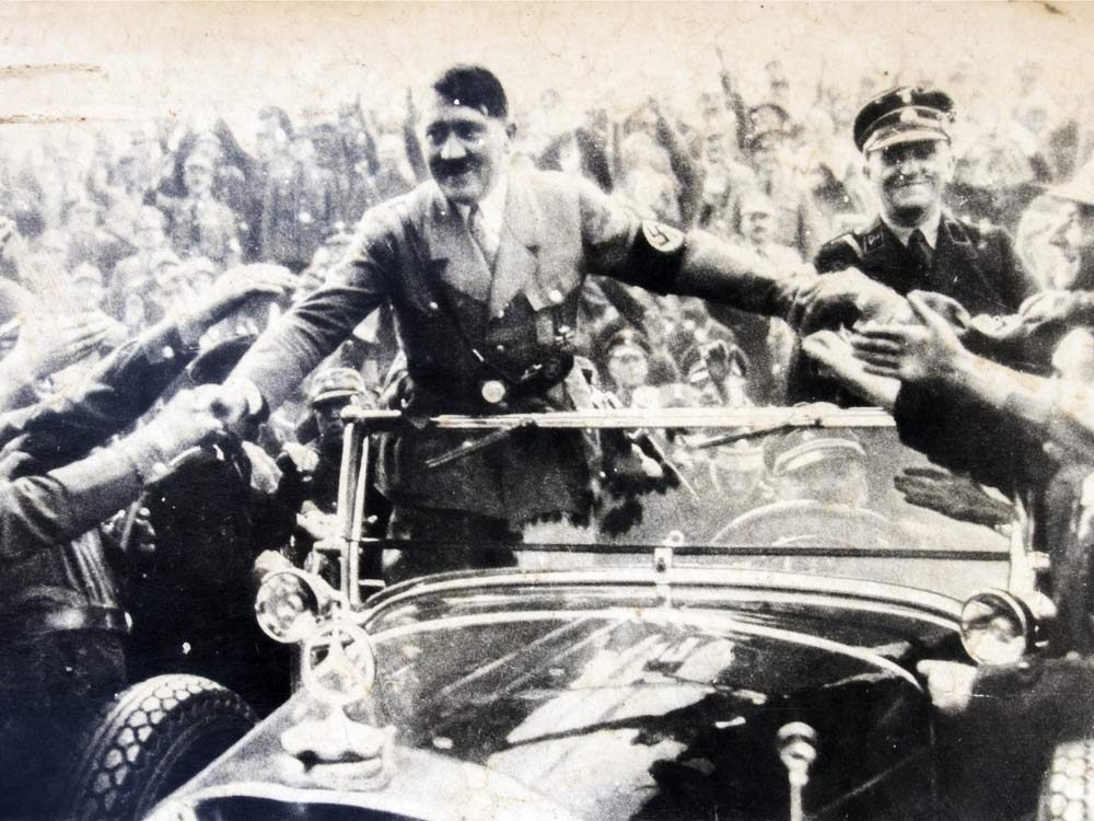 Adolf Hitler greeting his supporters