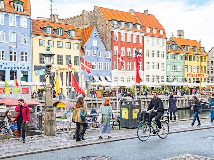 Facts about Denmark - cycling through Nyhavn