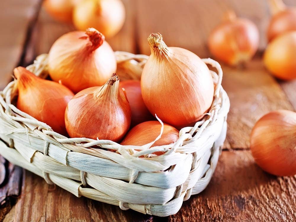Raw onions in basket