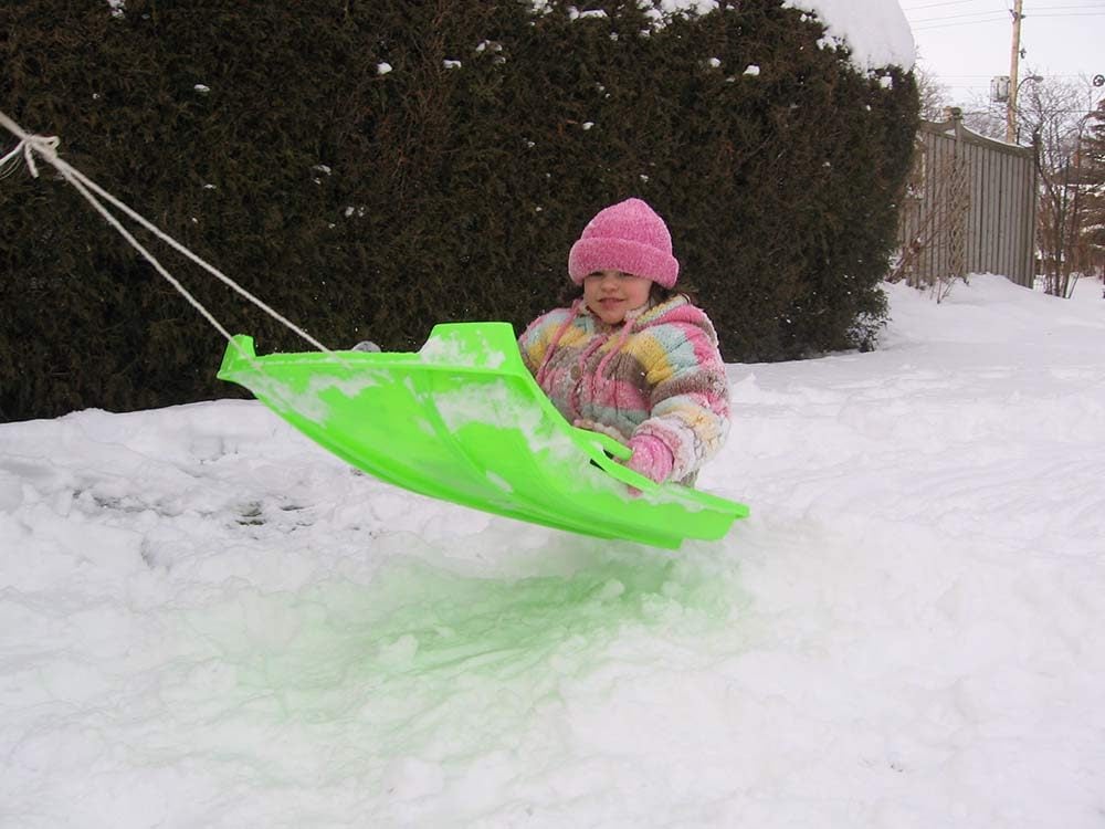 Young girl on sled